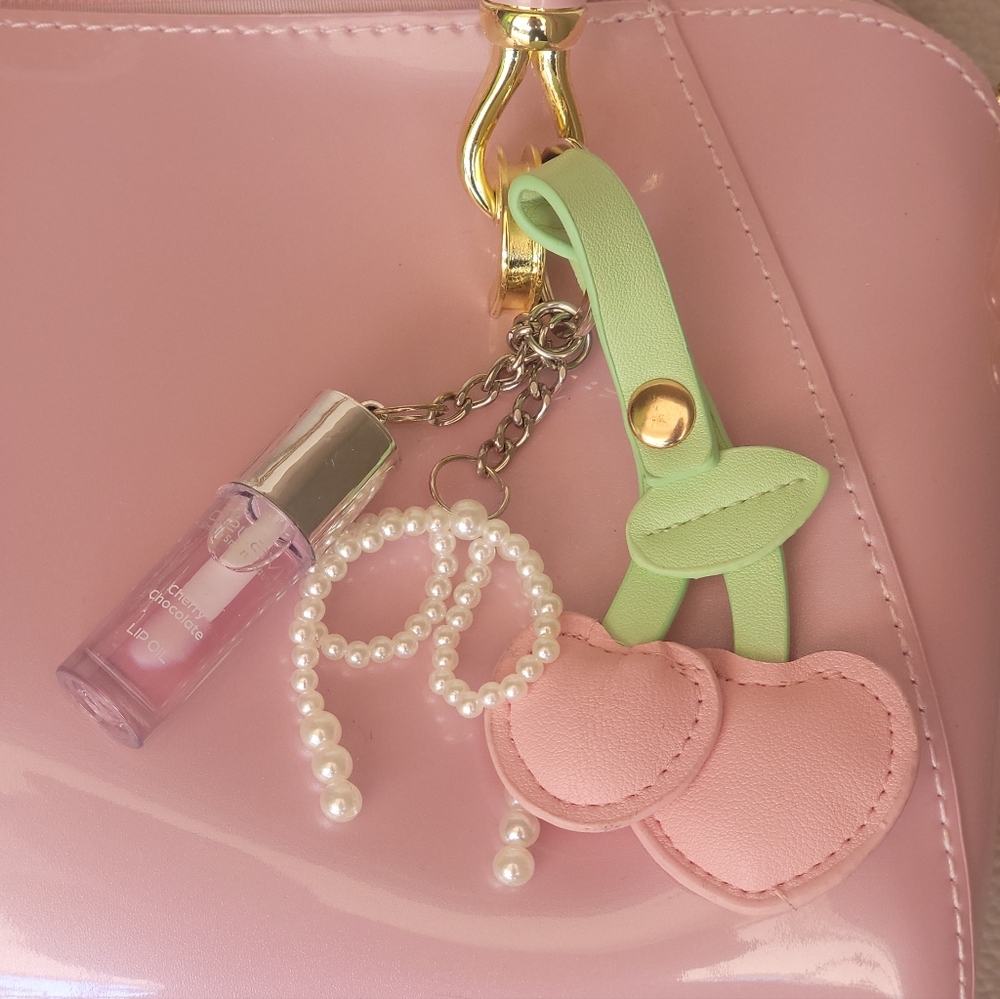 Elegant Pink Handbag with Gold Accents - Picture 2 of 7